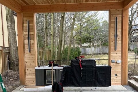 Covered patio with wood paneling