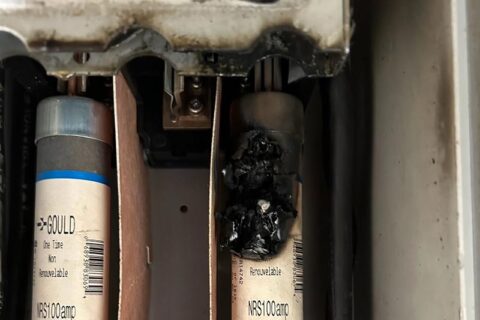 Close-up of two damaged electrical fuses