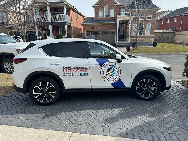 A white SUV with Scottish Gas Group Inc branding A white SUV with Scottish Gas Group Inc branding