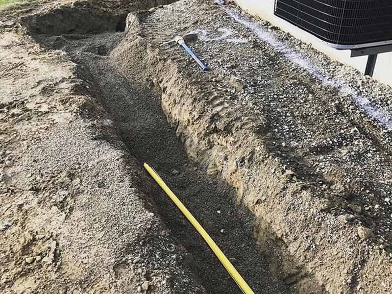 Digging a path to install a underground Gas pipe installation