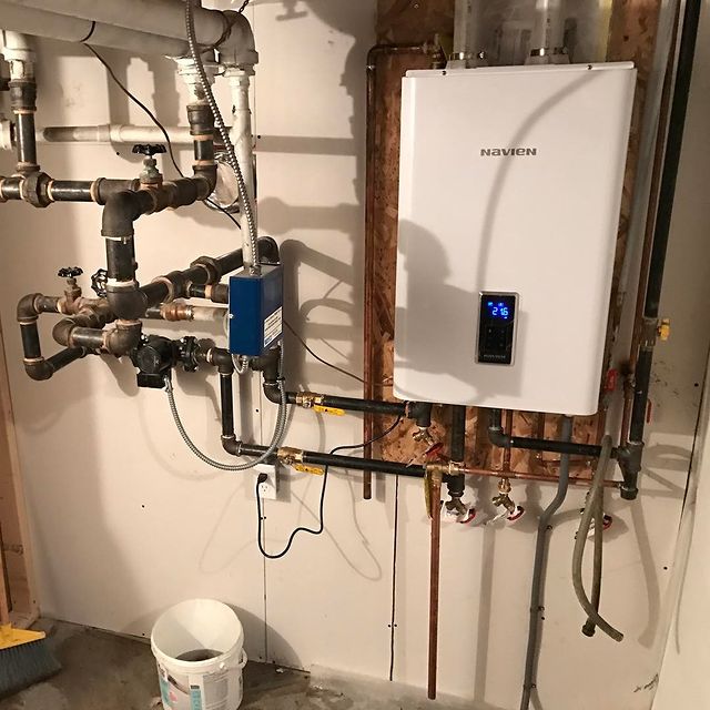 A white tankless water heater A white tankless water heater