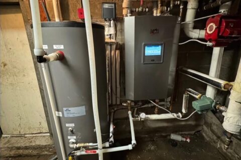 boiler room with a large gray water heater