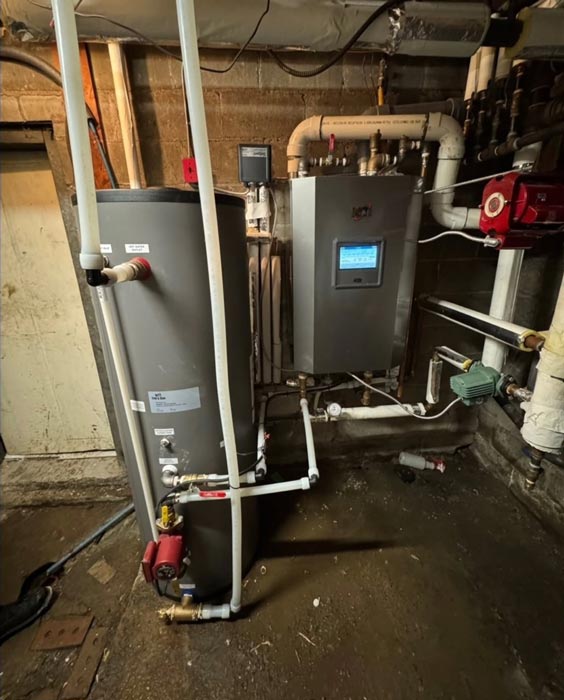boiler room with a large gray water heater boiler room with a large gray water heater