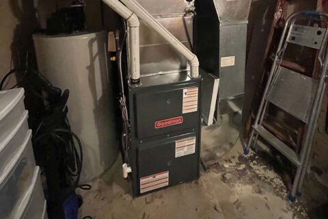 Basement with Goodman furnace, water heater, and PVC pipes