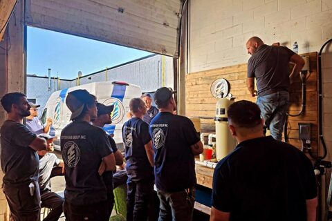 A group of men in a garage