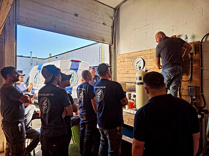 A group of men in a garage A group of men in a garage