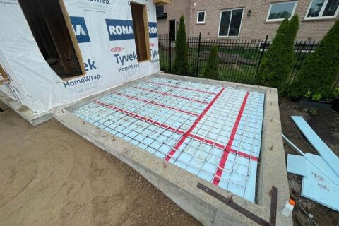 Construction site showing foundation with insulated concrete