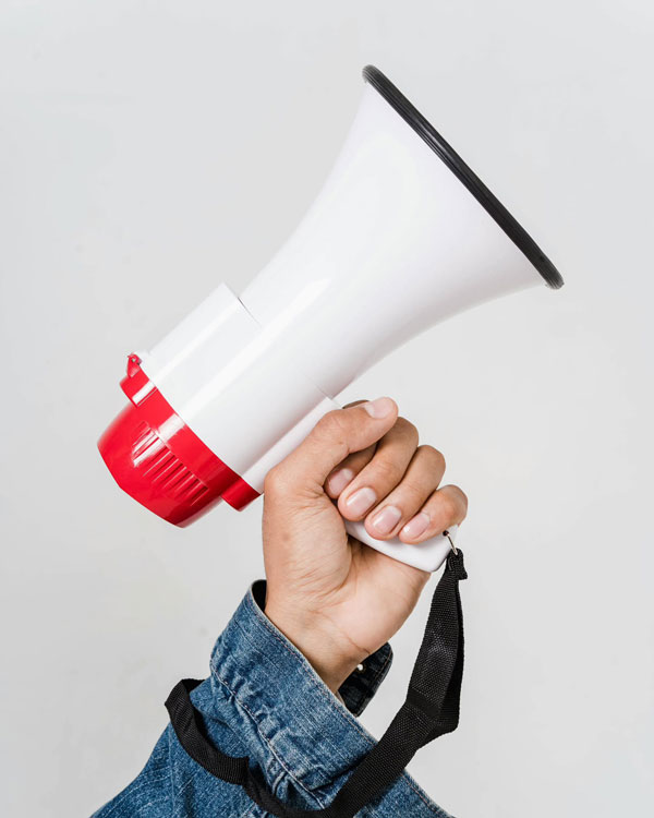a person holding megaphone a person holding megaphone